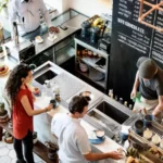 Busy Coffee Shop with Patrons at the Order Counter. Cafes and Restaurants are Common Breeding Grounds for Pests.