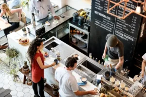 Busy Coffee Shop with Patrons at the Order Counter. Cafes and Restaurants are Common Breeding Grounds for Pests.