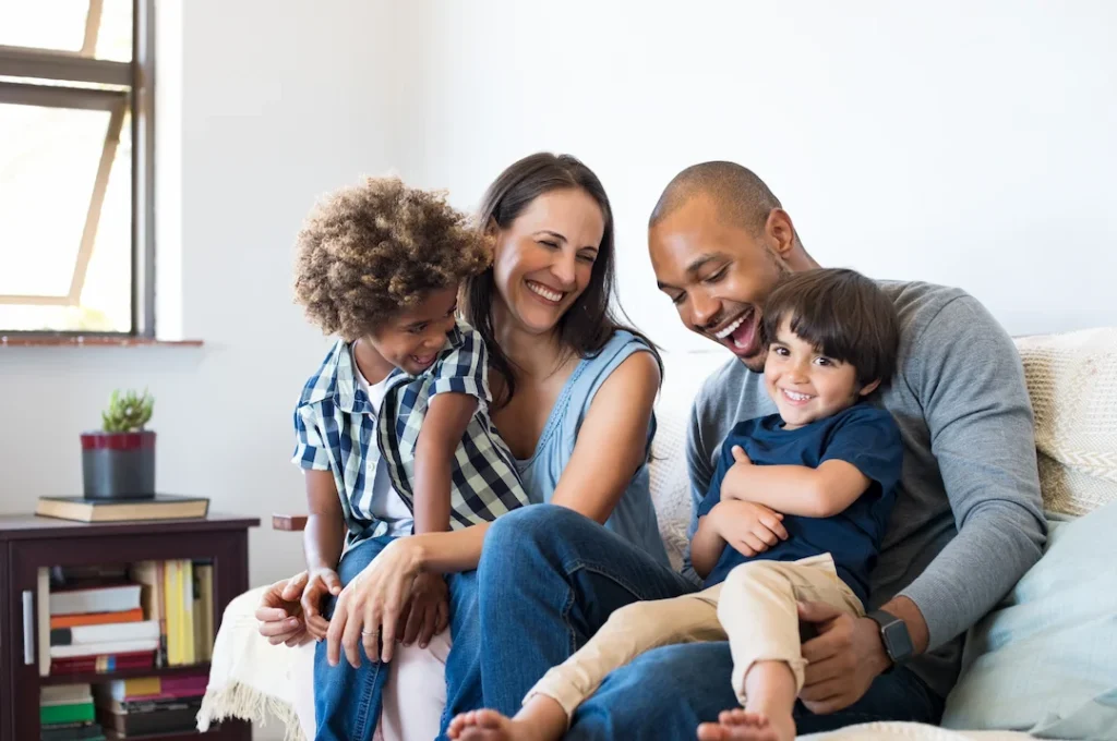 Family on a couch in their home - Keep pests away from your home with Florida Pest Control in FL